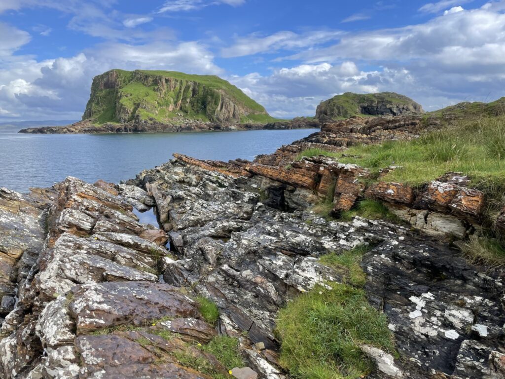 The dipping rock sequences on the Garvellach Islands, Scotland. These rocks date to around 720 million years ago, recording the transition into a global state of glaciation called Snowball Earth. Photo courtesy of Tom Gernon.
